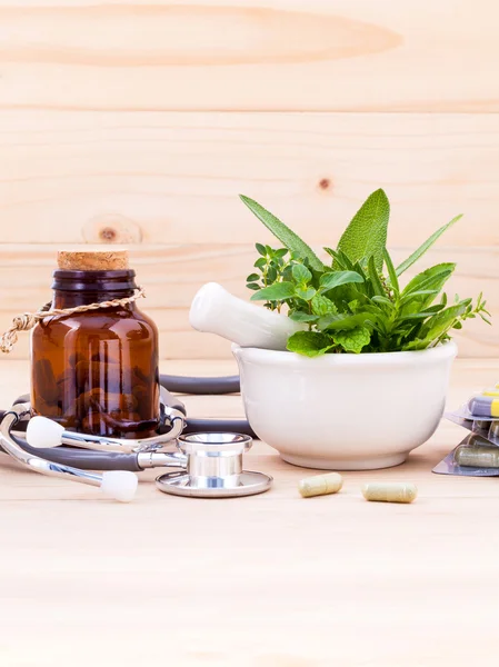 Capsule of herbal medicine alternative healthy care with stethos — Stockfoto