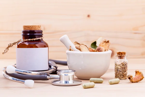 Capsule of herbal medicine alternative healthy care with stethos — Foto de Stock