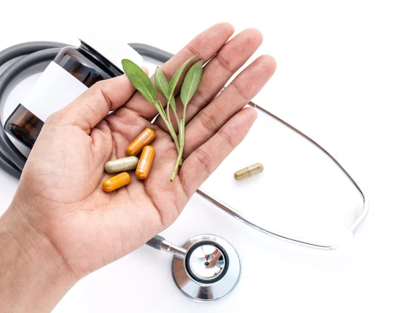 Alternative health care fresh herbal and capsule in doctor 's ha — 스톡 사진
