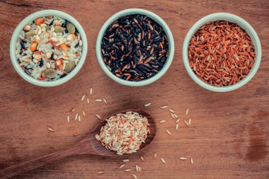 Mixed Whole grain Traditional Thai rice in the spoon and bowl be