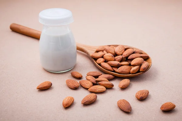 Homemade almond milk  in vintage bottle with almond — Zdjęcie stockowe