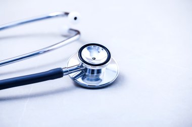 Stethoscope on white table with shallow depth of field