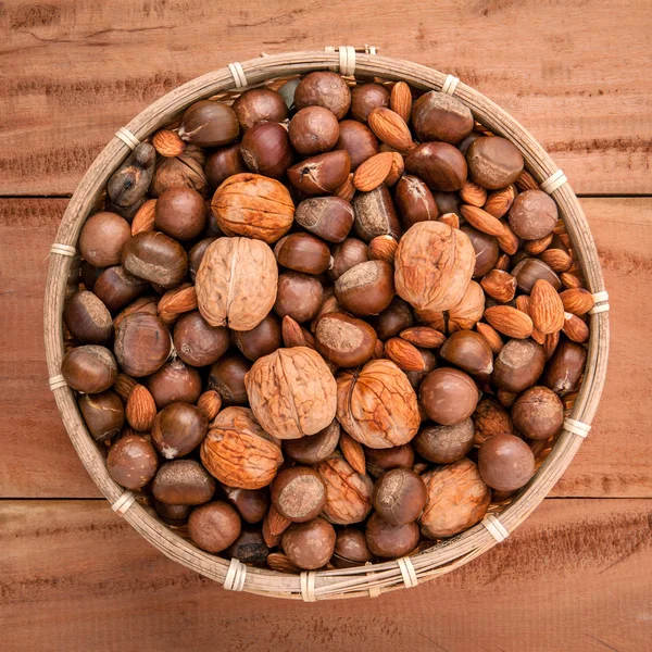 Mixed different kinds of nuts in shells ,cashew, almond, walnut — Zdjęcie stockowe