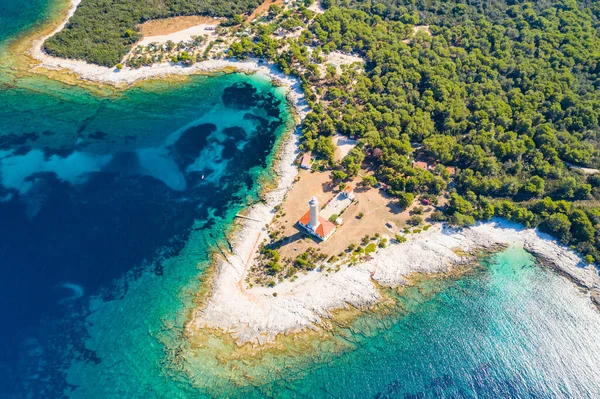 Drone aerial view of lighthouse tower of Veli Rat on the island of Dugi Otok, Croatia