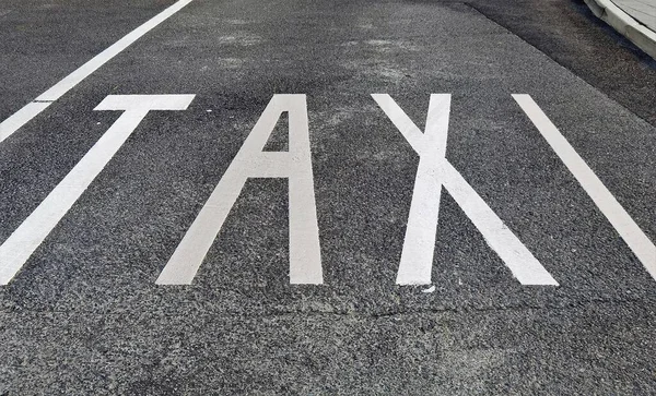 White Inscription Taxi Asphalt Road — Stock Photo, Image