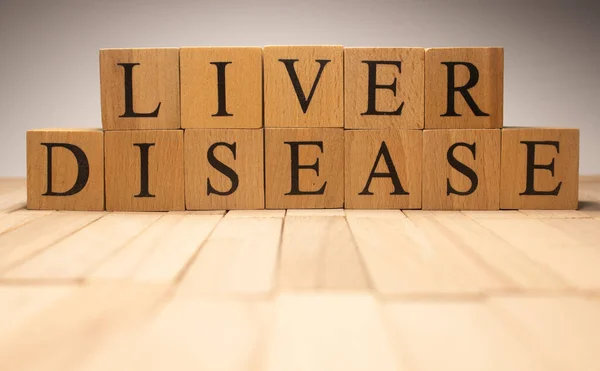 The word liver disease was created from wooden cubes. Health and life. Close up.