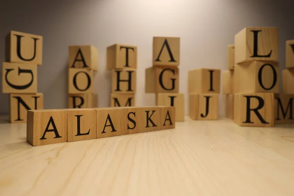Word Alaska Created Wooden Letter Cubes Cities Words Close — Stock Photo, Image