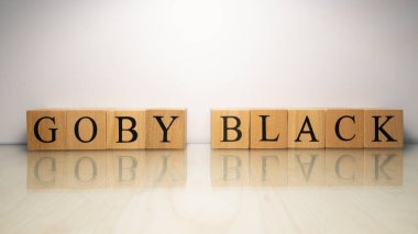 Goby Black ismi tahta harf küplerinden yaratıldı. Deniz ürünleri ve yiyecek. Kapat..