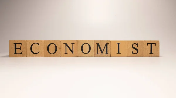 Όνομα Οικονομολόγος Δημιουργήθηκε Από Ξύλινους Κύβους Γραμμάτων Οικονομικά Και Οικονομικά — Φωτογραφία Αρχείου