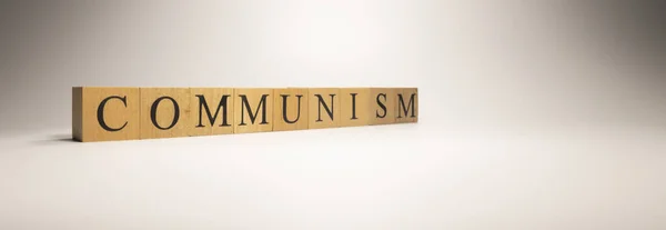 共产主义制度的名称是由木制字母立方体创建的 经济和金融 关门了 — 图库照片