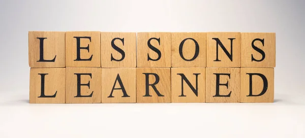 Word Lessons Learned Created Wooden Cubes Close — Stock Photo, Image