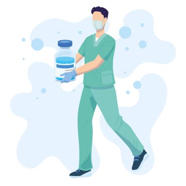 Erkek hemşire elinde büyük bir aşı şişesi tutuyor.