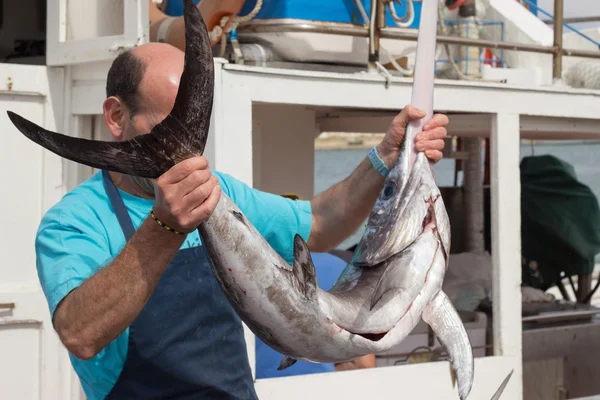 Fisherman with swordfish — Stock Photo, Image