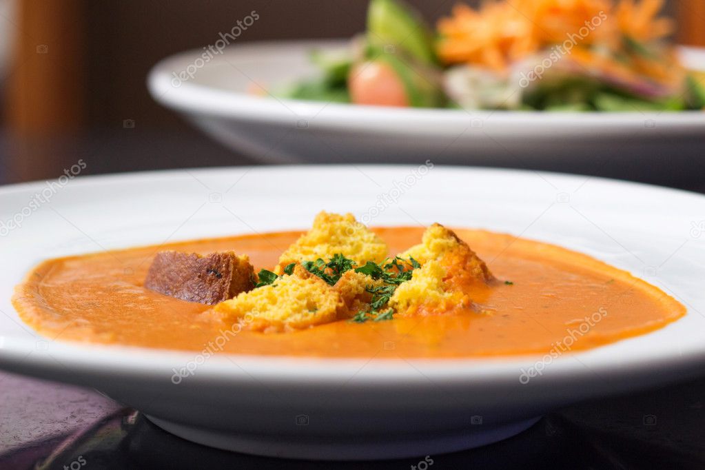 Tomato soup in plate at restaurant