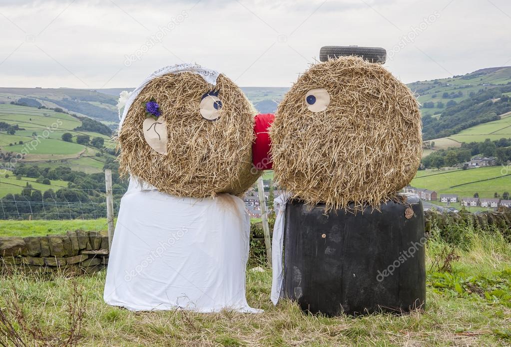 Wedding day couple made of straw
