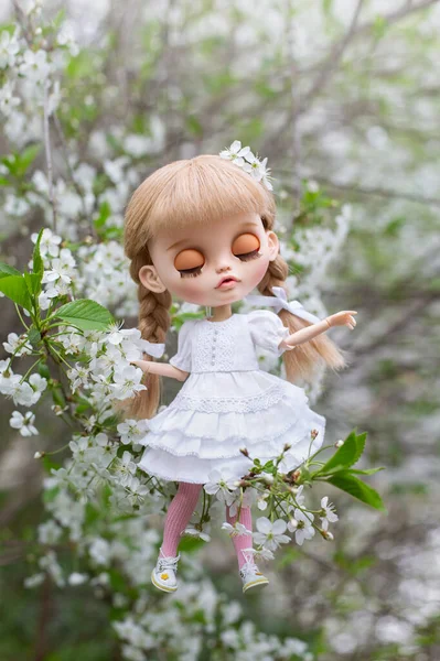 Blonde Doll Blythe Bangs White Dress Sits Twig Spring Cherry — Stock Photo, Image