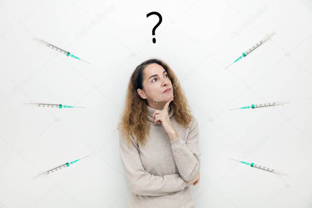 A woman with syringes around her thinking with serious face about question and doubts.
