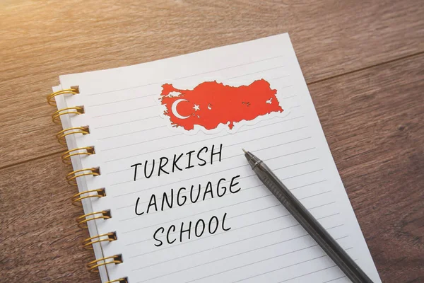 national flag of Turkey, a notebook with the inscription turkish language school, the concept of education and learning foreign languages