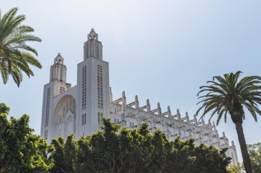 The outside of casablanca cathedral with tree clipart