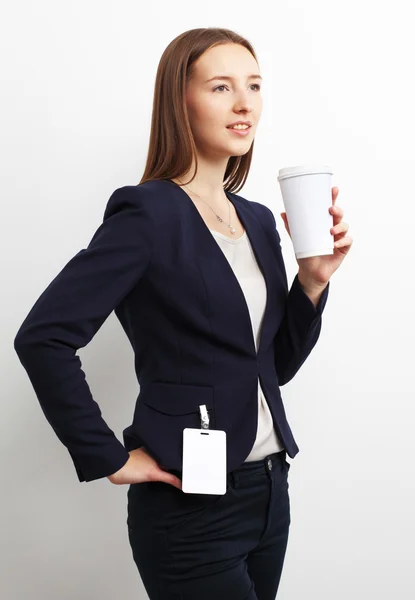 Imagen de una mujer de negocios sosteniendo una taza de café sobre blanco —  Fotos de Stock