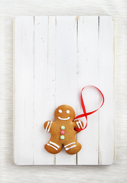 Image of Gingerbread man on white vintage cutting board