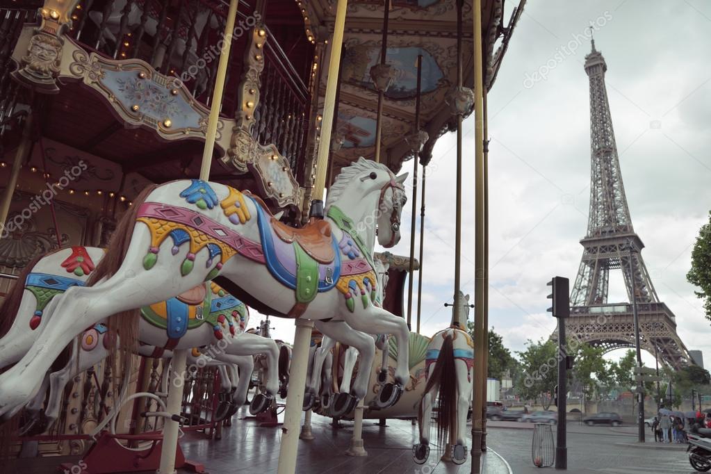 Image of vintage carousel near Eiffel tower in Paris, France