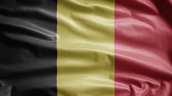 ベルギーの国旗が風になびく ベルギーのバナーを吹いて 柔らかく滑らかなシルクを閉じます 布生地の質感が背景を刻印 ナショナルデーや国の機会の概念のためにそれを使用する — ストック写真