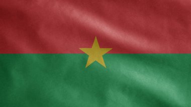 Burkina Faso bayrağı rüzgarda dalgalanıyor. Burkinabe afişini yakın çekin, yumuşak ve pürüzsüz ipek. Kumaş kumaş dokusu Asteğmen arkaplan.