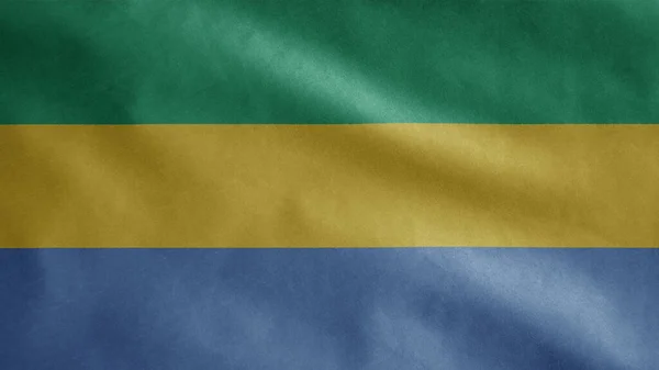 加蓬国旗在风中飘扬 靠近加蓬的旗帜 柔滑柔滑的丝绸 布匹织物质感标志背景 — 图库照片