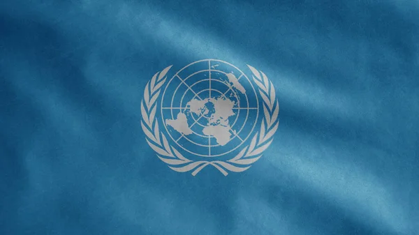 United Nations flag waving in the wind. Close up of UN banner blowing, soft and smooth silk. Cloth fabric texture ensign background. Use it for national day and country occasions concept.