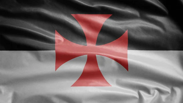 The knights templars flag waving in the wind. Poor fellow soldiers of christ and temple of solomon banner blowing, soft and smooth silk. Cloth fabric texture ensign background