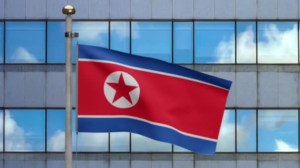 Северокорейский Флаг Машущий Ветру Современным Небоскребом Города Корейское Знамя Раздувает — стоковое видео