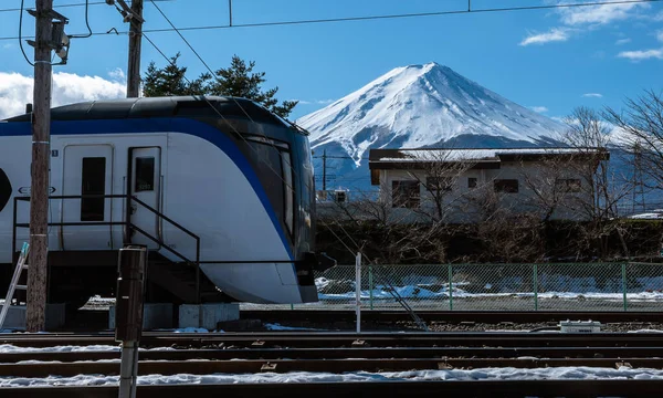 Beautiful view of Fuji mountain with snow cover on the top from the train station. Winter seasons japanese landscape, landmark travel place of Japan.