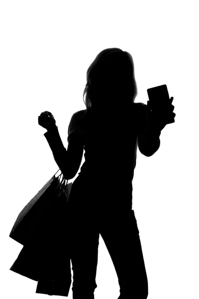Silhouette di donna con shopping bag — Foto Stock