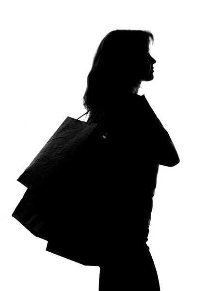 Silueta ženy s nákupní tašky — Stock fotografie