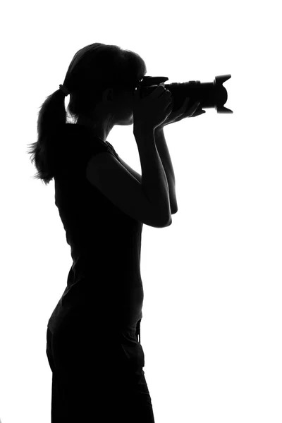 Woman takes a photo by camera — Stock Photo, Image