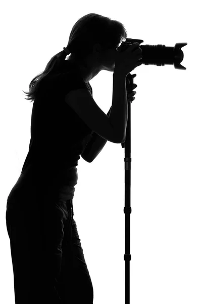 Silhouette of a woman with a camera — Stock Photo, Image