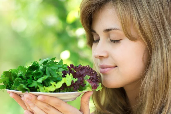 Woman smelling the aroma of green — Stock Photo, Image