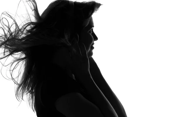 Silhouet van een vrouw met hoofdtelefoon — Stockfoto