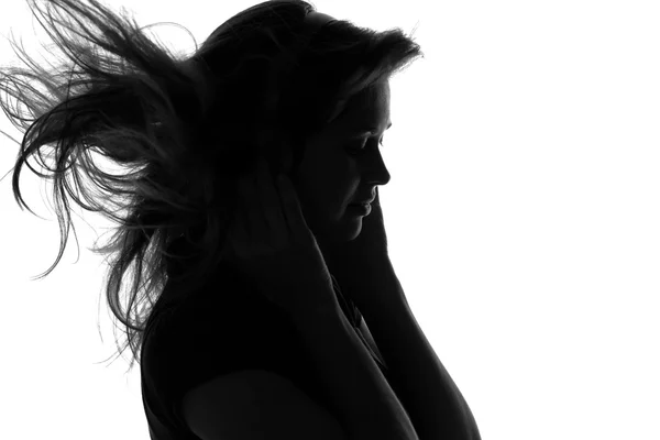 Silueta de una mujer con auriculares — Foto de Stock