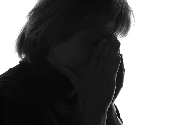 Silhouette of a sad pensive woman — Stock Photo, Image