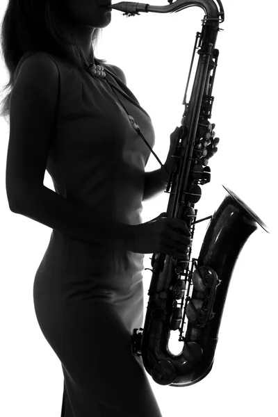 Silhouette of a woman with a saxophone — Stock Photo, Image