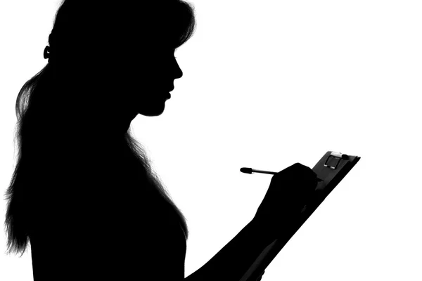 Portrait en silhouette d'une jeune femme qui a écrit la déclaration — Photo