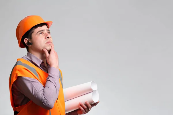 Young Constructor Hard Hat Reflective Vest Thinking Hand Chin Grey — Stock Photo, Image