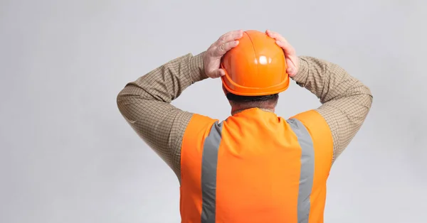Back Contruction Worker Clutching His Head Helmet Grey Studio Background —  Fotos de Stock