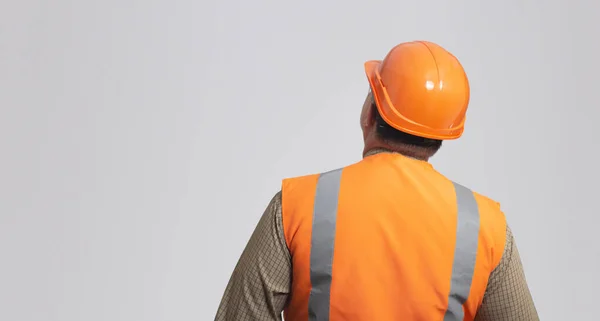 Back Contruction Worker Hard Hat Reflective Vest Grey Studio Background — ストック写真