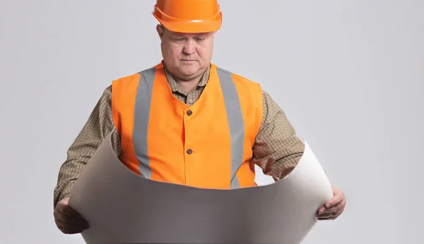 Onstruction Worker Hard Hat Looking Opened Paper Project Hands Grey — Stock Photo, Image