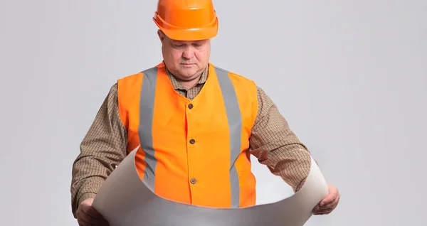 Onstruction Worker Hard Hat Looking Opened Paper Project Hands Grey — Stock Photo, Image