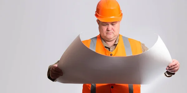 Onstruction Worker Hard Hat Looking Opened Paper Project Hands Grey — Stockfoto