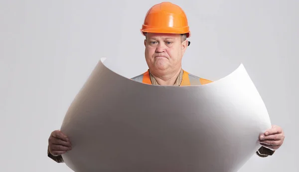Onstruction Worker Hard Hat Looking Opened Paper Project Hands Grey — Stock Fotó